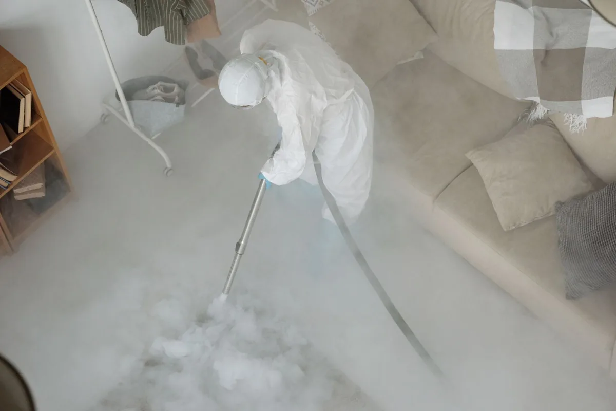 Biohazard cleanup technician in protective equipment, Lakeport, CA